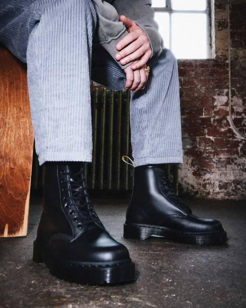 best sustainable leather boots, person wearing Dr. Martens Vegan Winter Boots