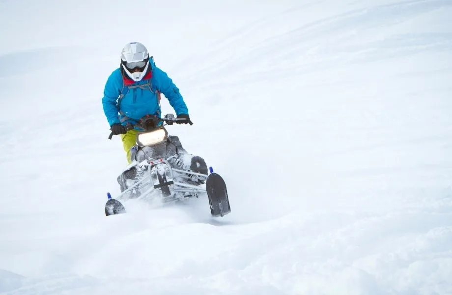 snowmobile resorts in Wisconsin, person riding a snowmobile