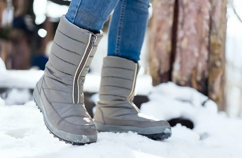 best vegan winter boot brands, warm grey boots in the snow