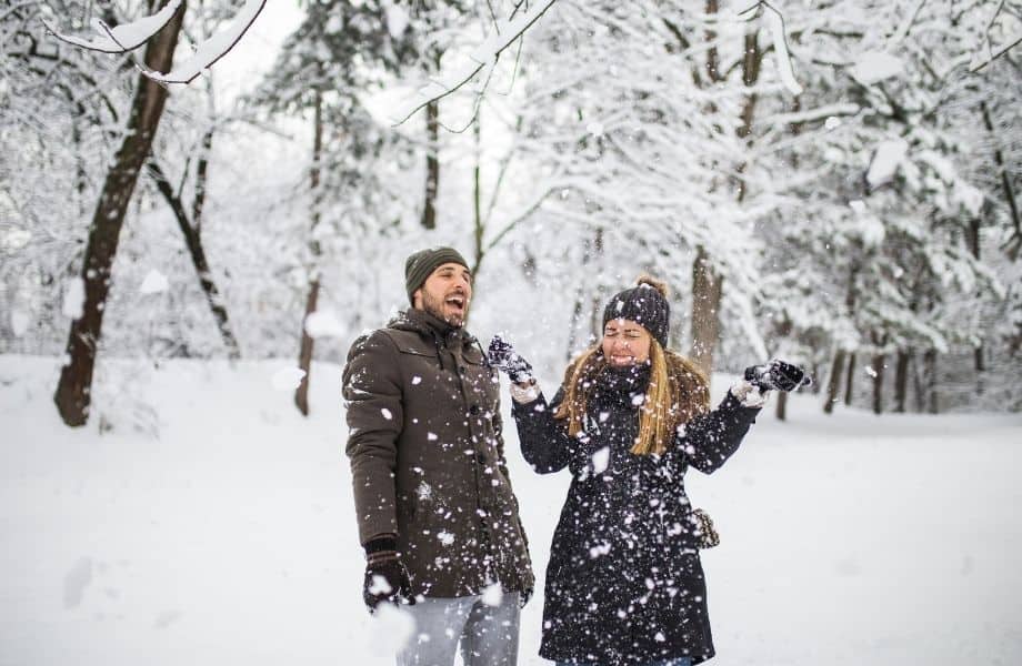 best men and womens vegan winter coats, man and woman out in the snow