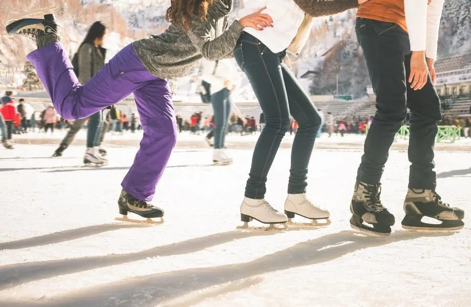 best wisconsin winter family getaways, three kids having fun ice skating
