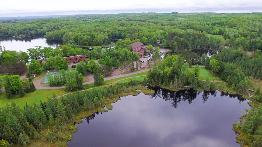 Best winter retreats in Wisconsin, aerial view of Lakewoods Resort and Lodge surrounded by wilderness and lakes