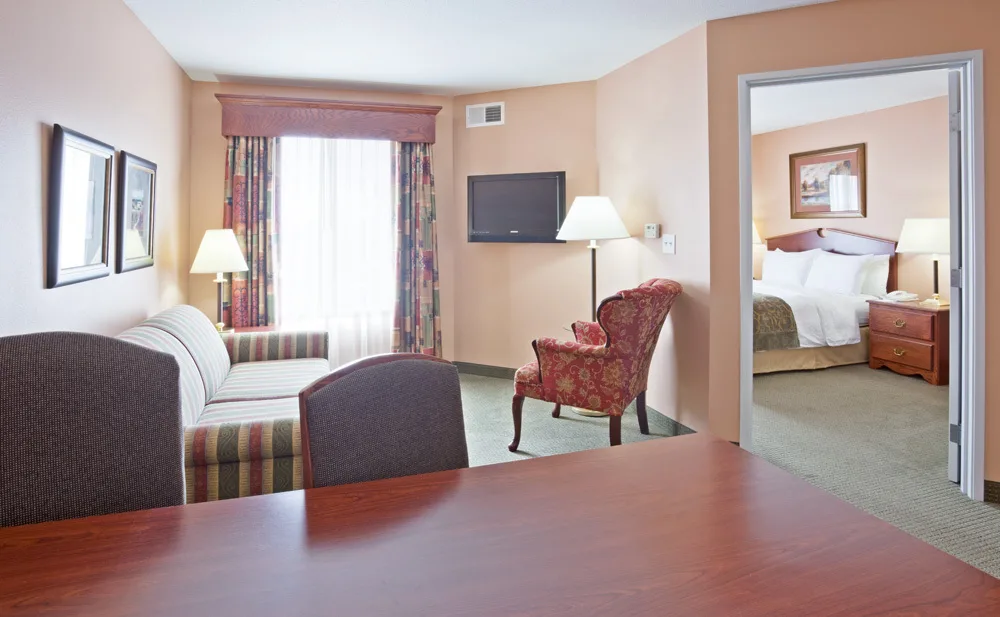 where to stay in Sheboygan Wisconsin, large hotel room with bed and seating area at GrandStay Sheboygan
