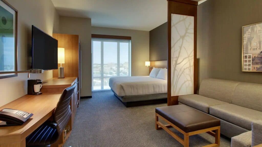 top hotels in Milwaukee that allow dogs, room with bed, desk, wardrobe, tv and seating area