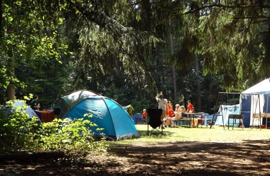 best family camping near Wisconsin Dells, family group of tents set up with family hanging out