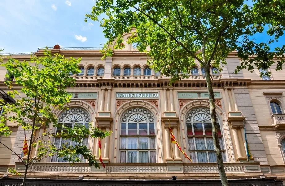 famous building in barcelona spain, front of the Gran Teatre del Liceu with flags out front