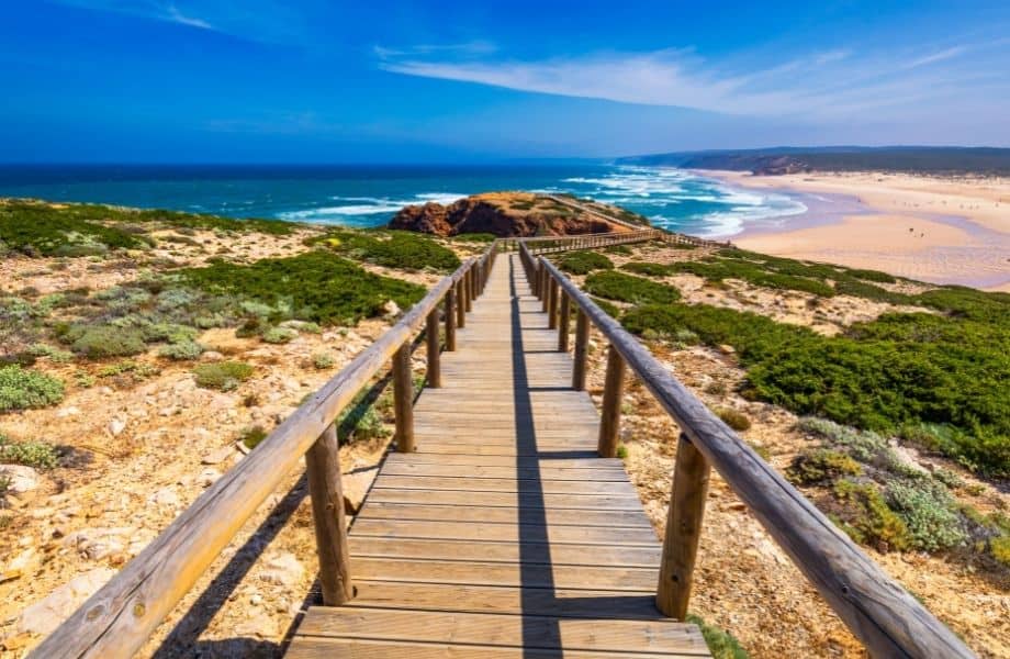 amazing algarve walking holidays, wooden walking path going for miles down to a beach