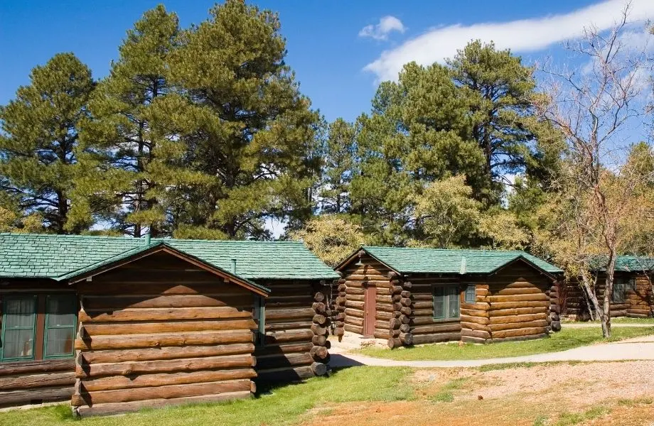 best wisconsin dells campgrounds with cabins, several log cabins next to trees