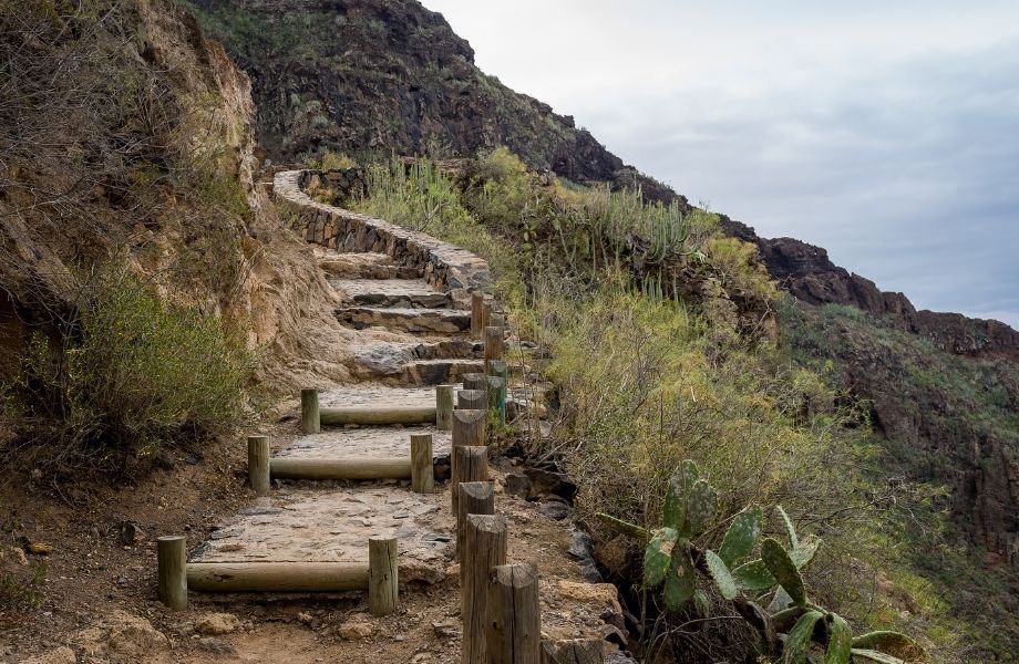 Amazing Tenerife attractions, path with rocky steps that curves around mountain