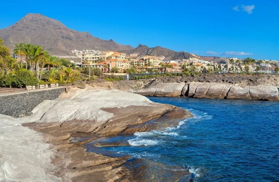 where to live in Tenerife, view of Costa Adeje from the water with mountain in background