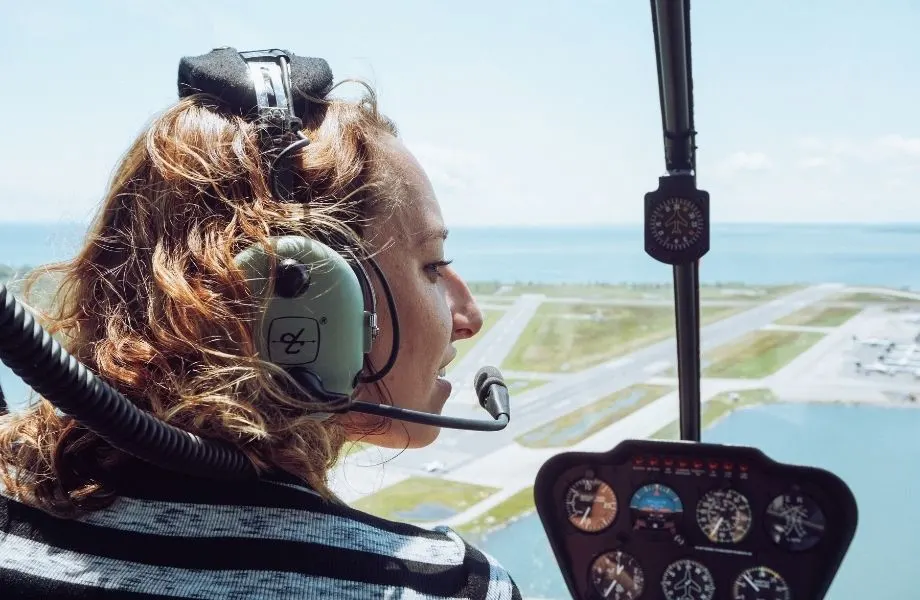 best holidays in Costa Adeje, helicopter pilot talking into headphone mic above runway