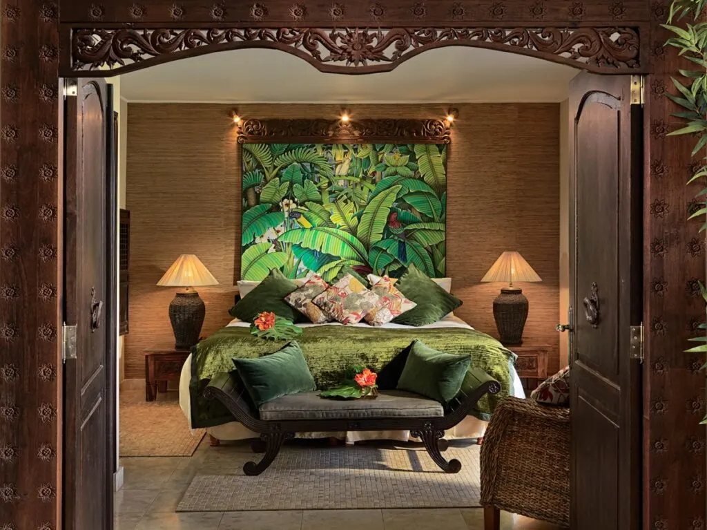 Best spa hotels in Costa Adeje Tenerife, doorway looking into hotel room with bed and settee decorated in green