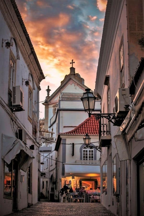 things to do in Albufeira old town, old buildings and small shop at sunset