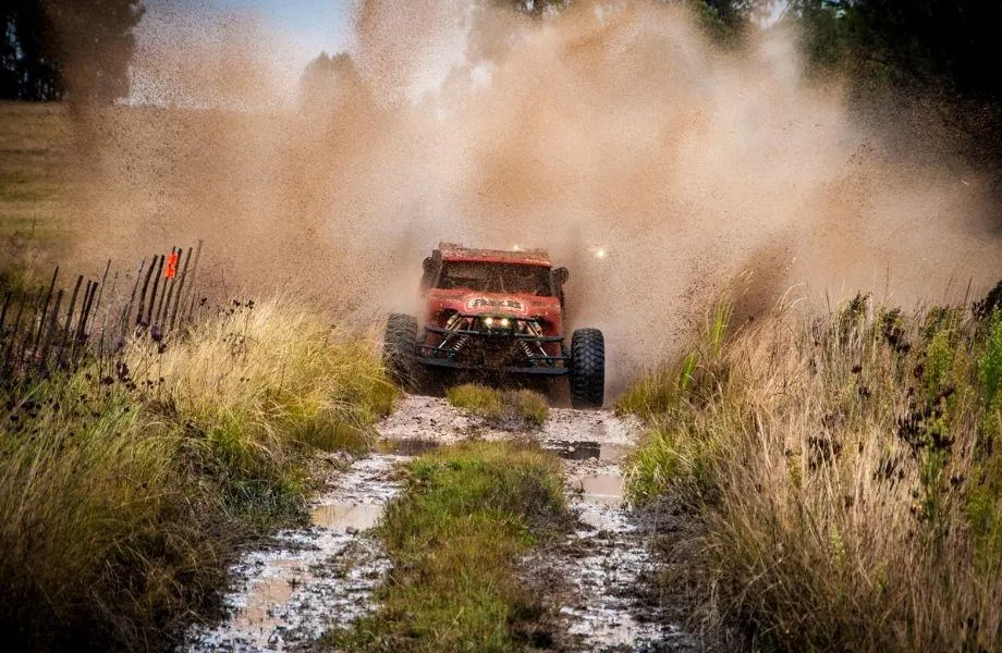 Fun activities in Tenerife, off road buggy riding through muddy path next to a field