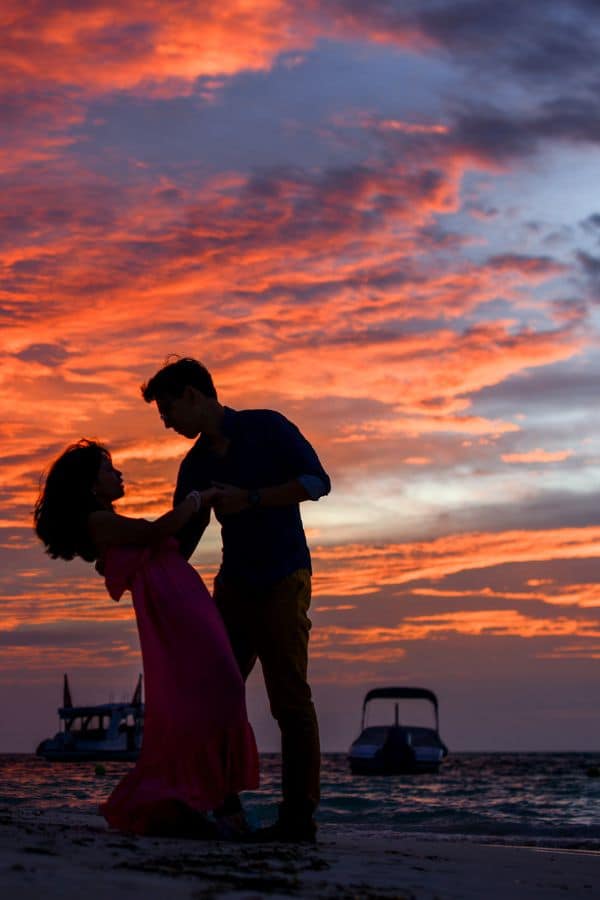 a couple dancing while there is a sunset at one of the best romantic hotels in Door County