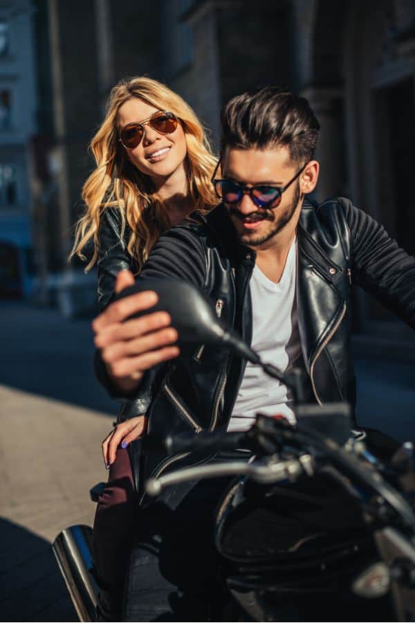 a couple enjoying riding a motorcycle together