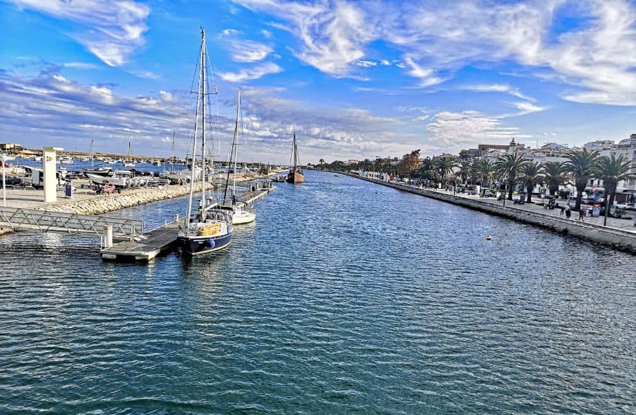 top tourist attractions in Lagos, view of Lagos Marina with boats and pier on left and coast on right