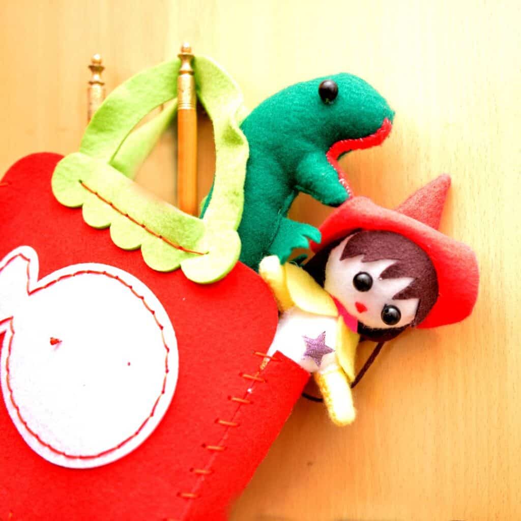 a red and green bag with a toy in it