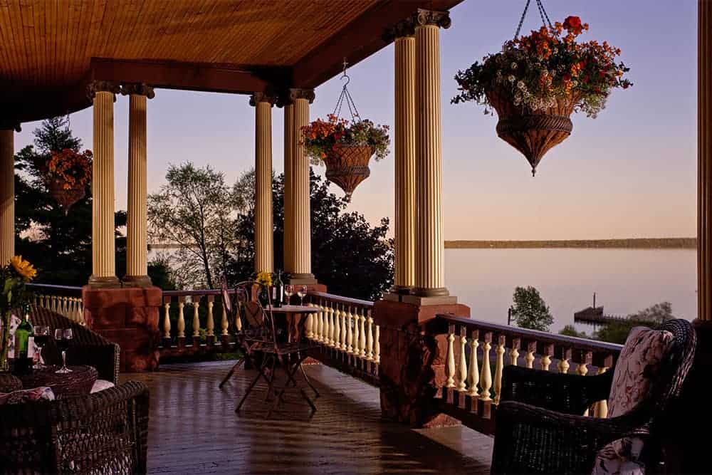 wisconsin haunted hotels, view of lake from hotel porch with covering and large columns