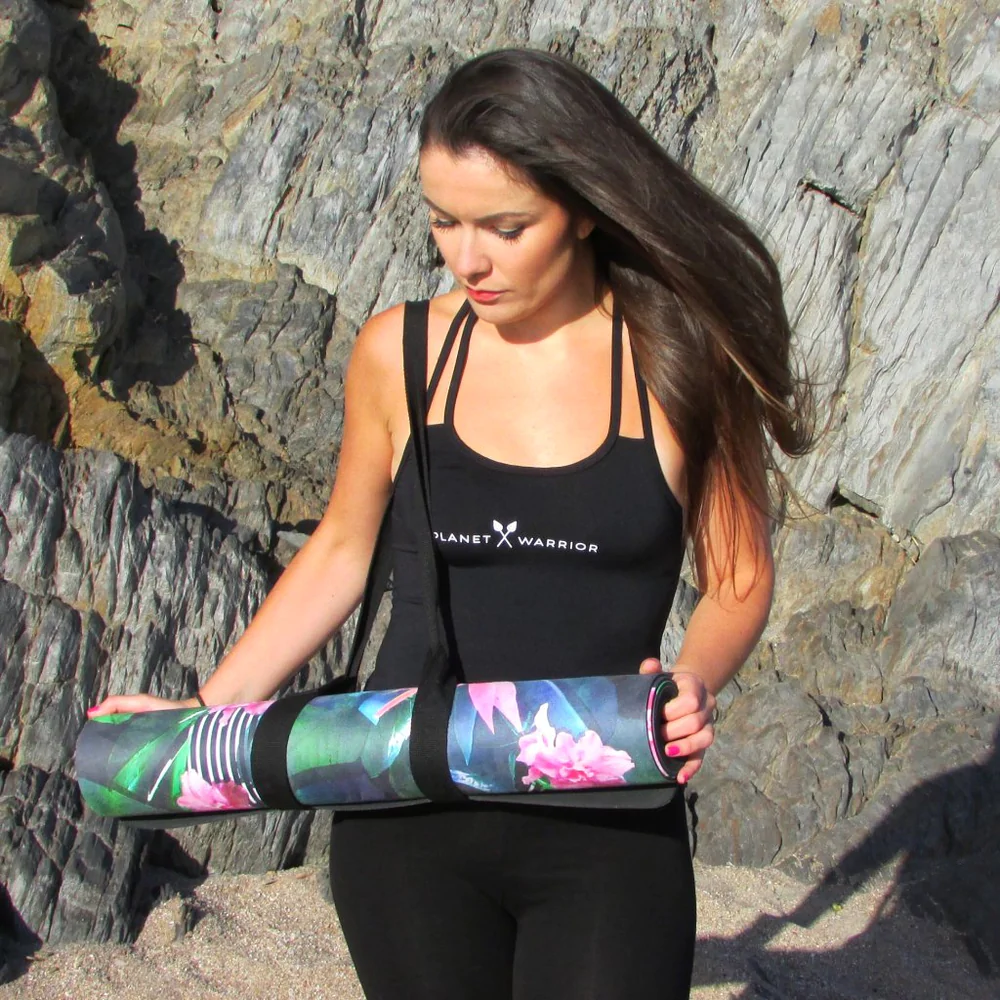 most ethical yoga mats, woman carrying rolled up yoga mat
