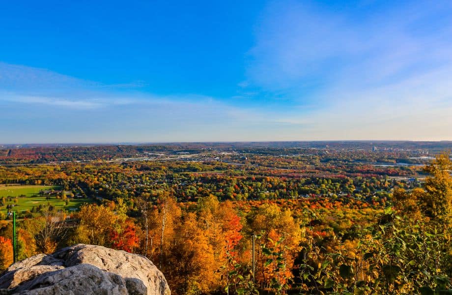 things to do in Wisconsin in the fall, view from Granite Peak over miles of fields and trees in the fall on a sunny day