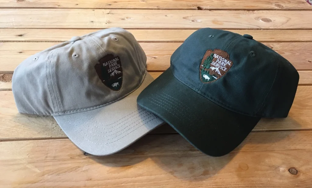 fun national park service gifts, two baseball caps with national park service patches