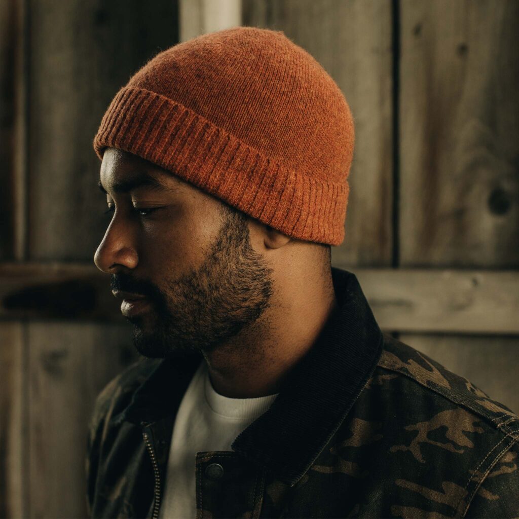 top gift ideas for national park lovers, black man wearing orange knit beanie