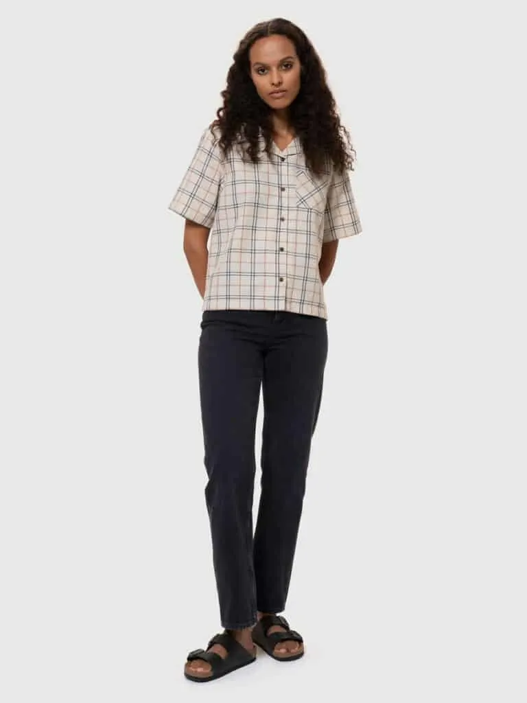 most durable jeans, southeast asian woman wearing flannel shirt and black jeans
