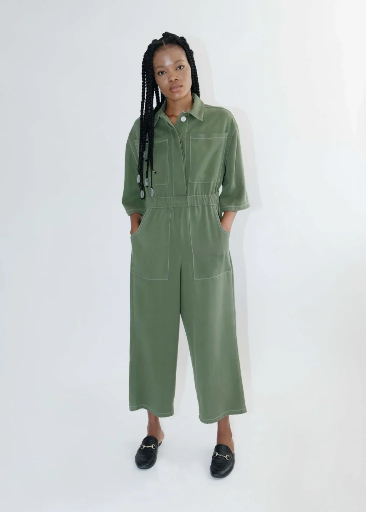 top zero waste clothing brands, black woman wearing olive green jumpsuit