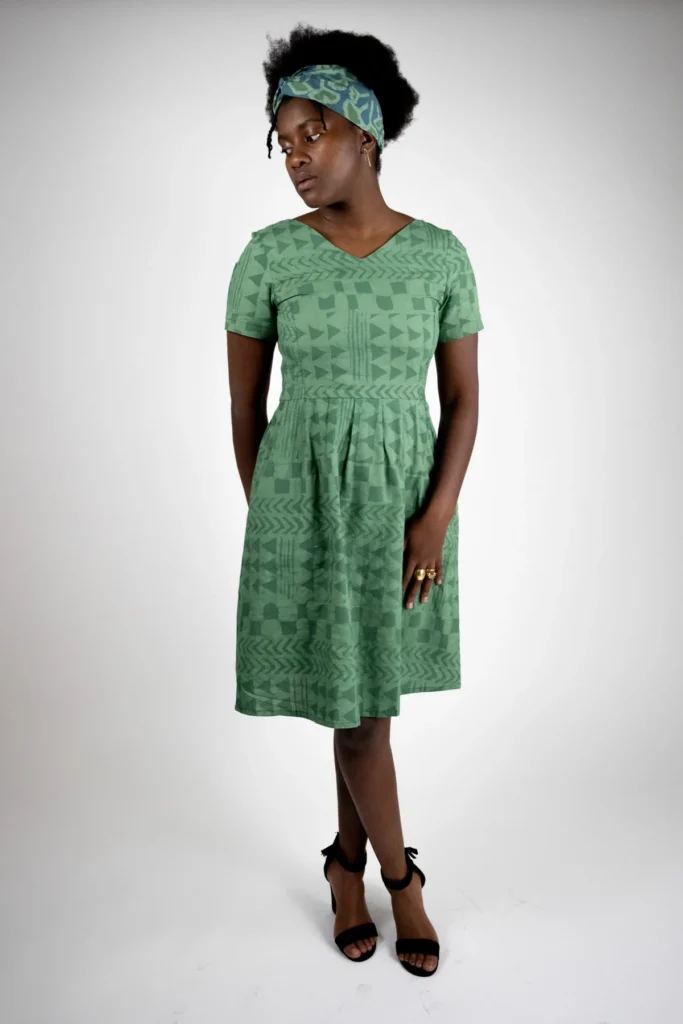 best zero waste designers, black woman wearing green patterned dress