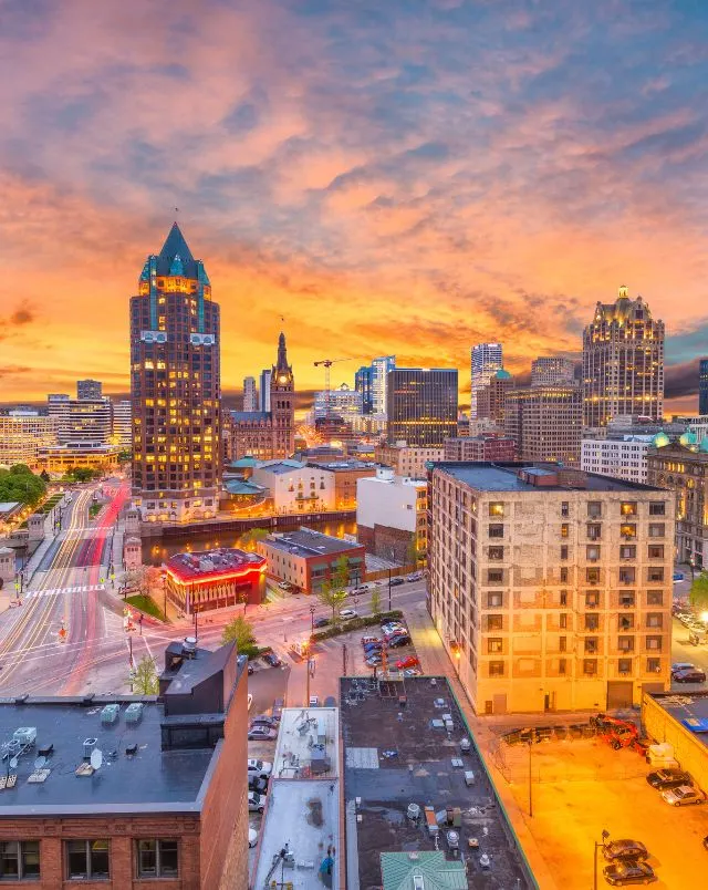 best Wisconsin road trip itinerary, view of downtown Milwaukee lit up at sunset