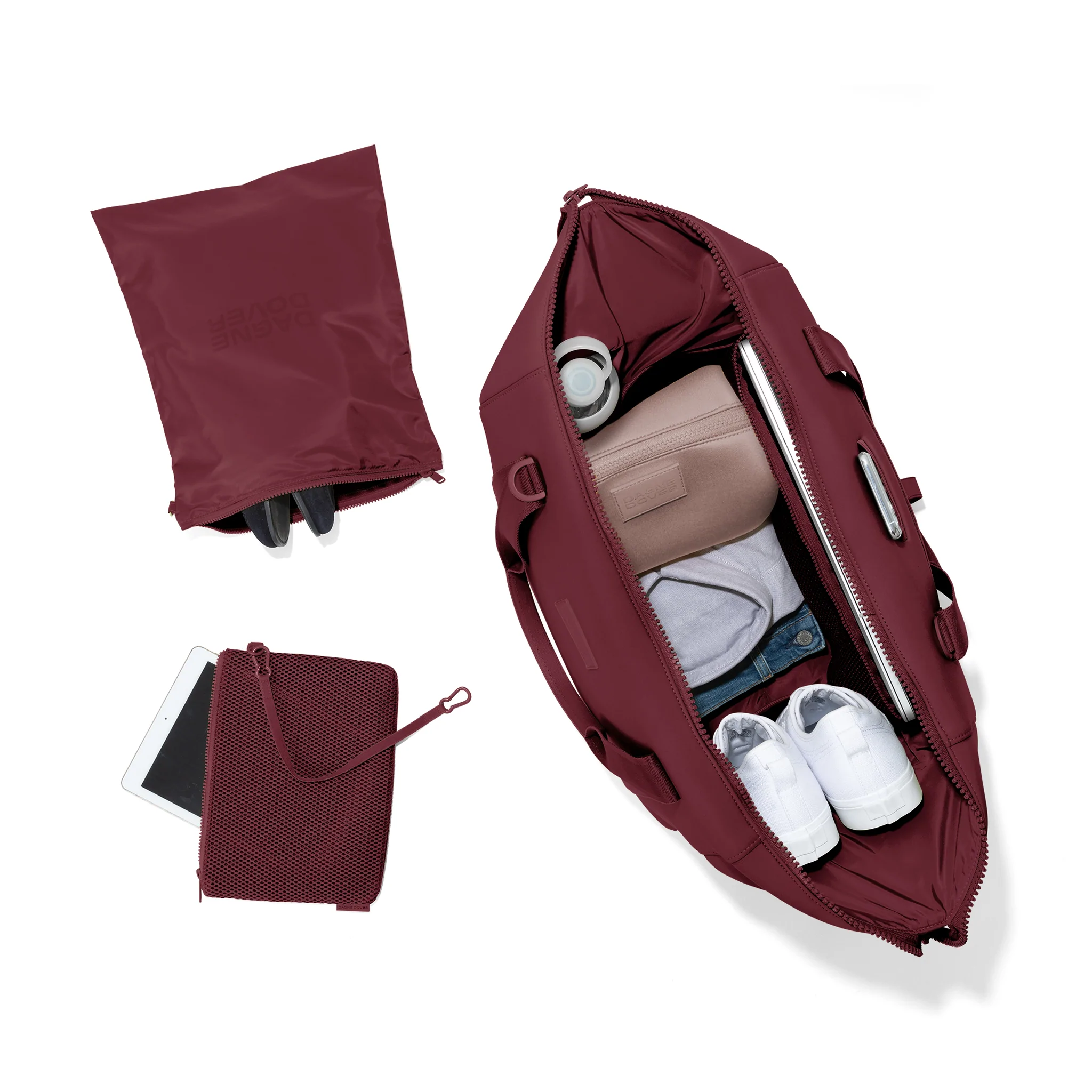 best sustainable weekend bag brands, view of dark red weekend bag from the top open to show shoes, clothes, toiletries bag and laptop, next to bag are two smaller bags for smaller items