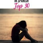 girl hunched feeling sad with sunset on the background, Sad quotes in Spanish top 30
