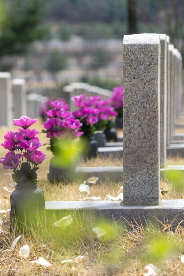 a cemetery filled with flowers