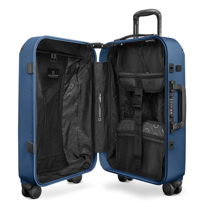 where to get the best sustainable luggage, dark blue wheelie suitcase that has been unzipped to show compartments inside but is still upright