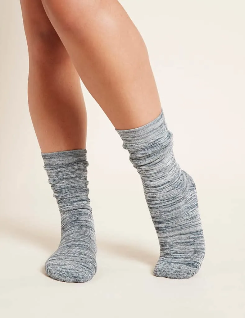 most ethical sock brands, legs of white person from just below the knee posing in socks showing different tones of grey
