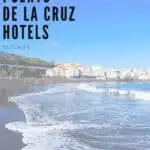Pin with faded image of people on a beach with white washed city in background under blue sky, text over upper left corner of image reads '15 best Puerto de la Cruz hotels: Tenerife'