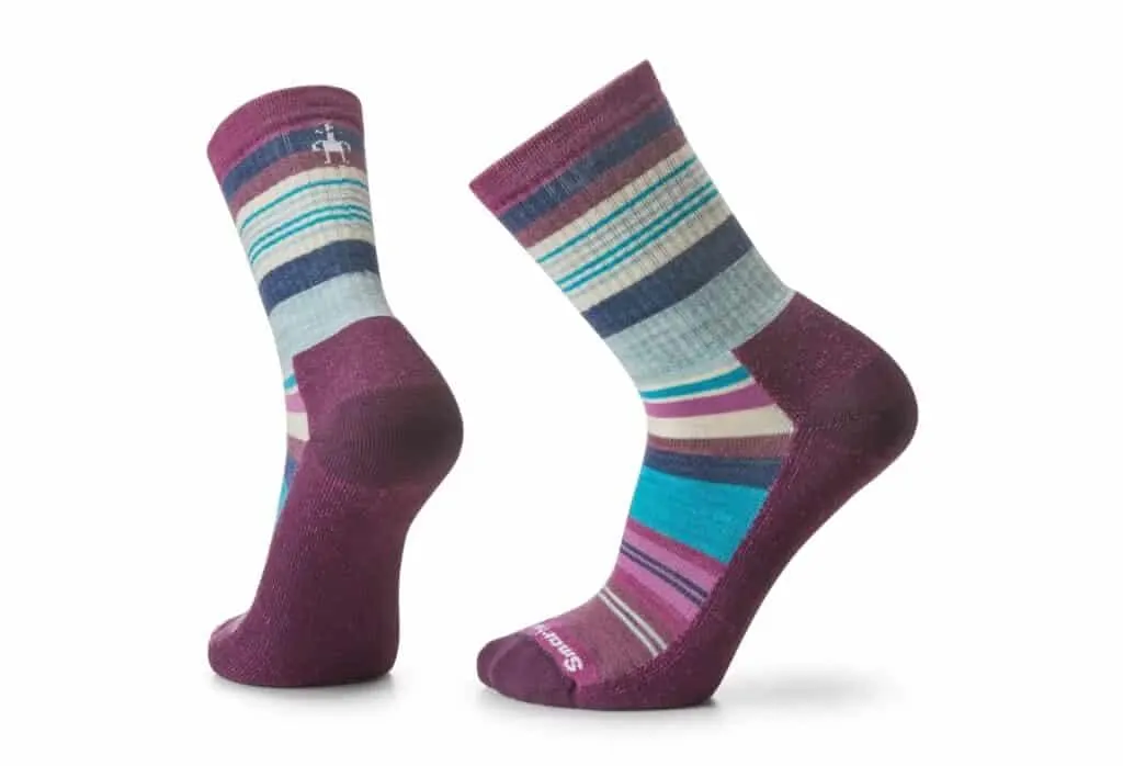 sustainable wool socks, pair of Smartwool stripe socks that are purple, blue, white, teal and pink