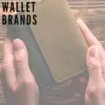 Pin with faded image of person's hands holding a wallet over a wooden table and text over corner of photo reading, "15 amazing sustainable wallet brands"