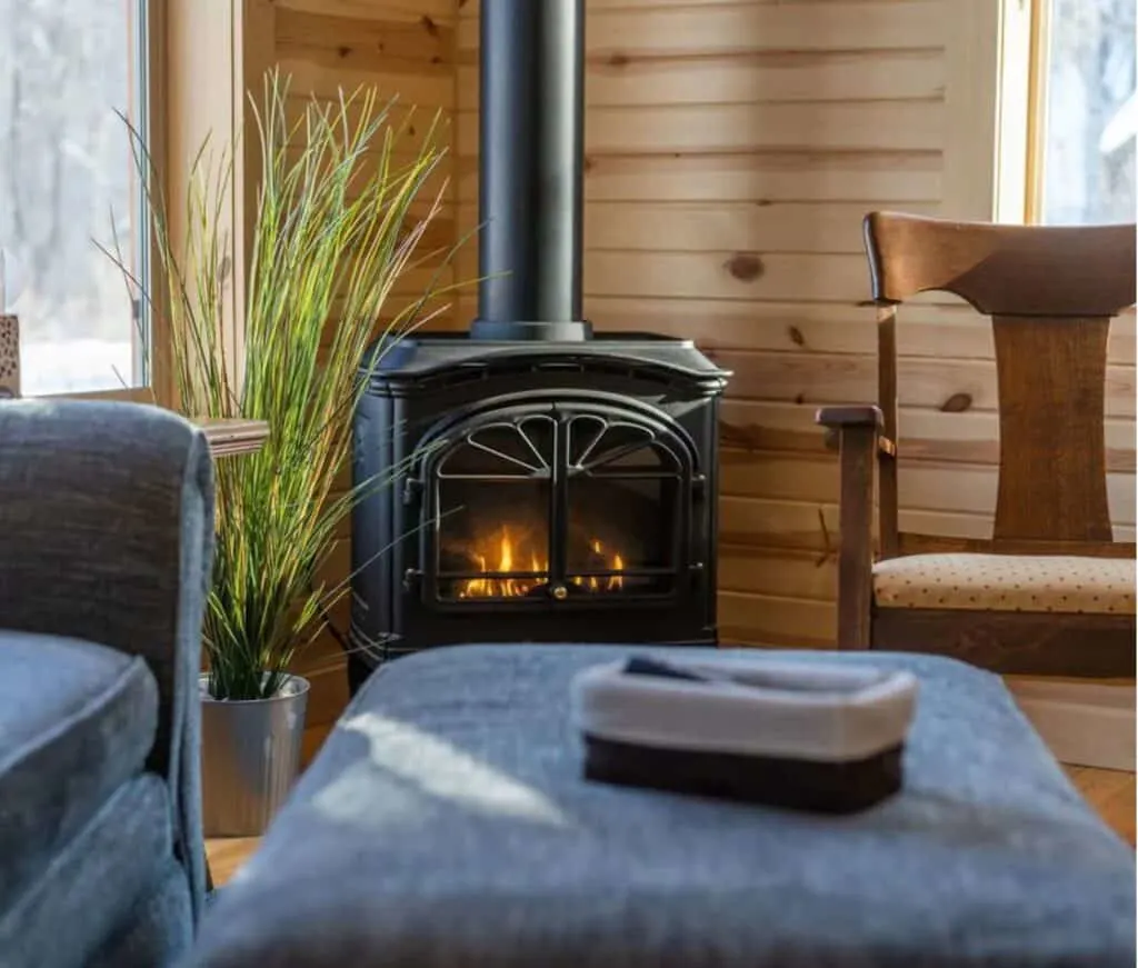 fire place and cozy armchair at one of the best rustic Cabin rentals in Wisconsin 