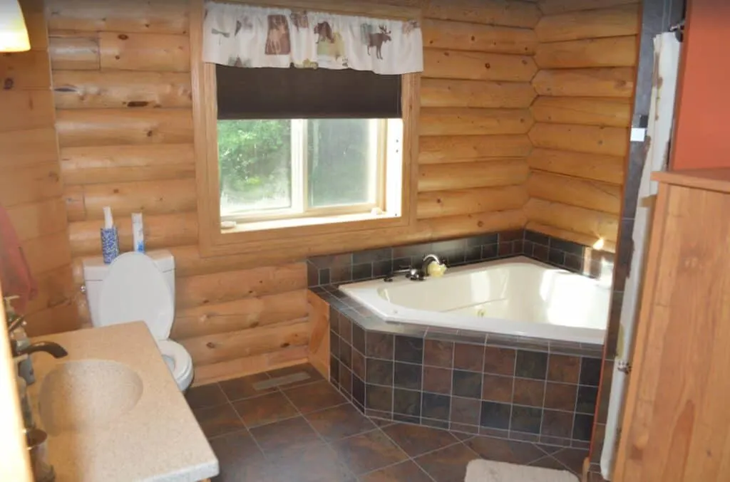 hot tub cabin in the woods, hot tub in the room