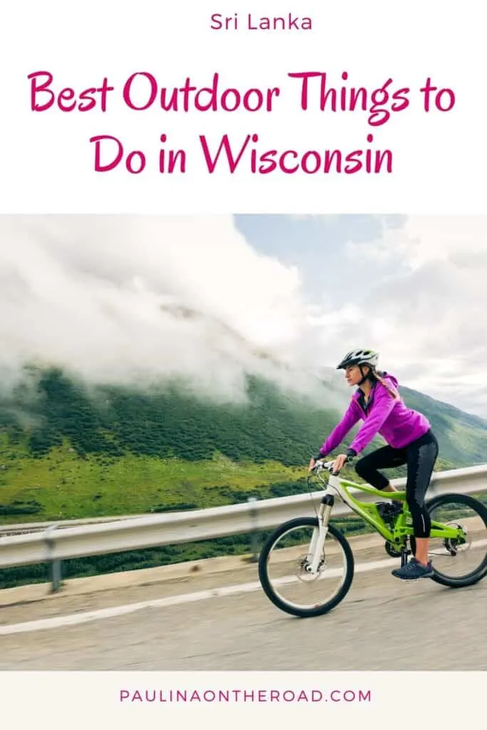 a pin with a woman riding her bike on a road in wisconsin