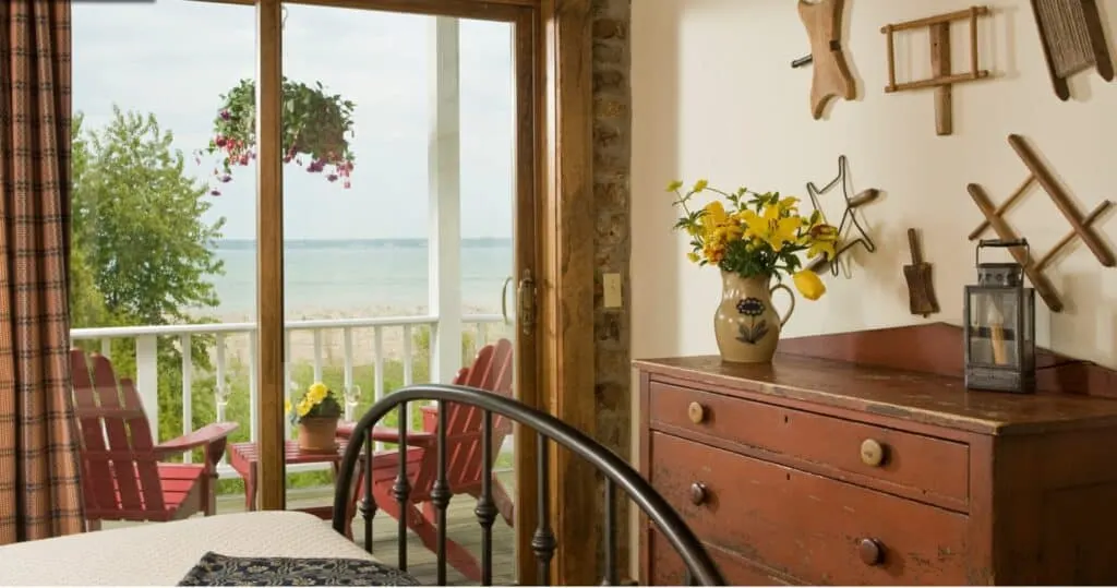 view of a room with lake michigan in the background, at one of the best resorts in Door County on the water