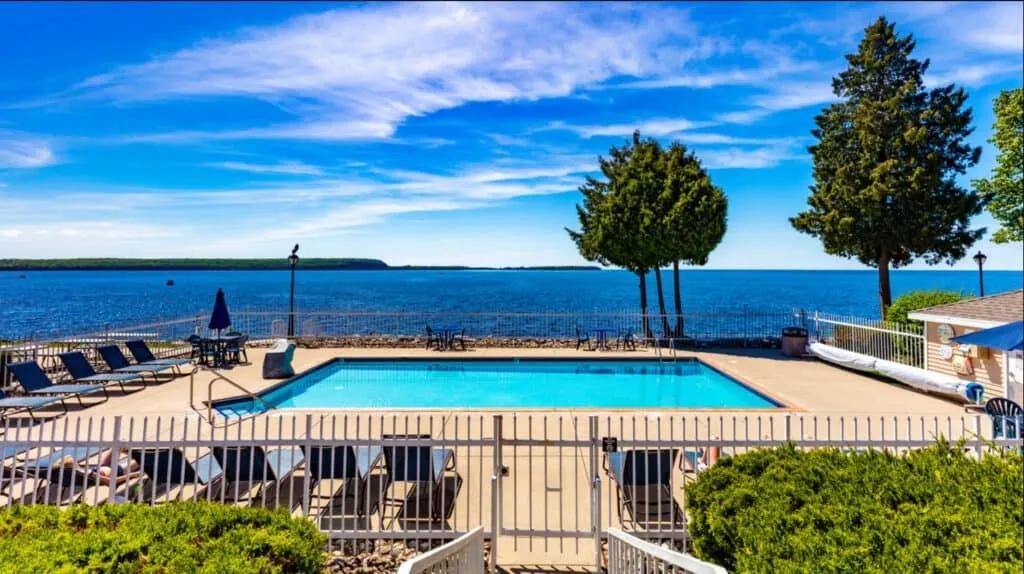 view with the pool and lake at Westwood Shores Waterfront Resort - Sturgeon Bay