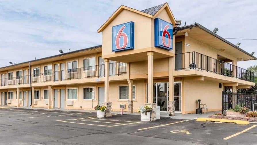 Motel 6 Oshkosh seen from the outside with the parking lot - 14 Cool Hotels in Oshkosh for All Budgets