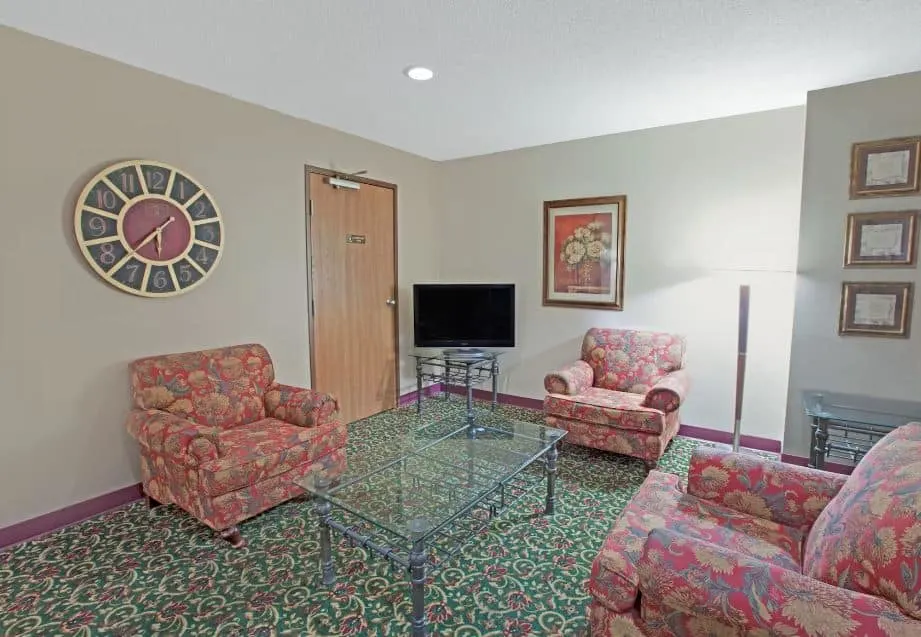 a room with armchairs deocrated in a classy way at the Baymont Inn Suites by Wyndham Richmond - 10 Best Pet-Friendly Hotels in Lake Geneva, Wisconsin