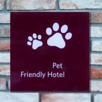 a sign with pet friendly hotel on a hotel wall in Lake Geneva