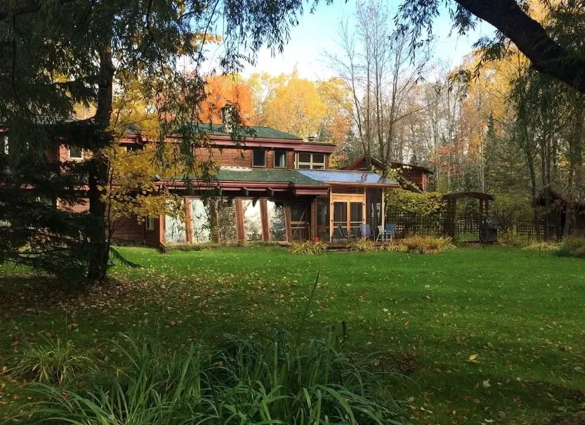 backyard with green area at Custom Built Home Nestled in the Woods Apostle Island - 14 Unique Airbnbs in Apostle Islands