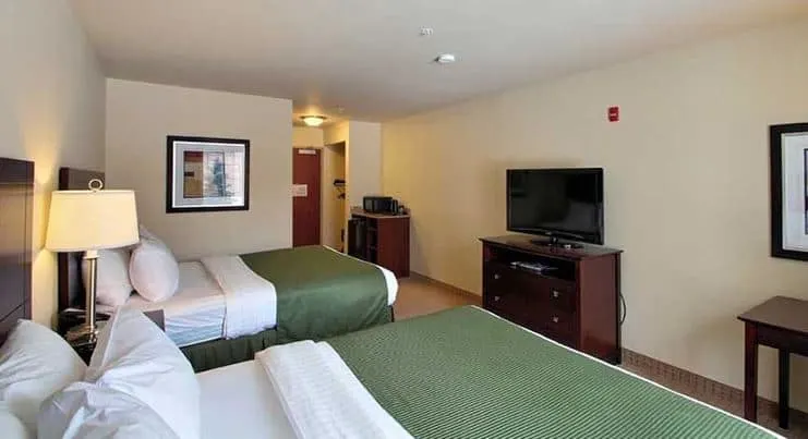 bedroom with 2 separate beds at Cobblestone Inn Suites Brillion Wisconsin - 12 Best Resorts on Lake Winnebago, Wisconsin