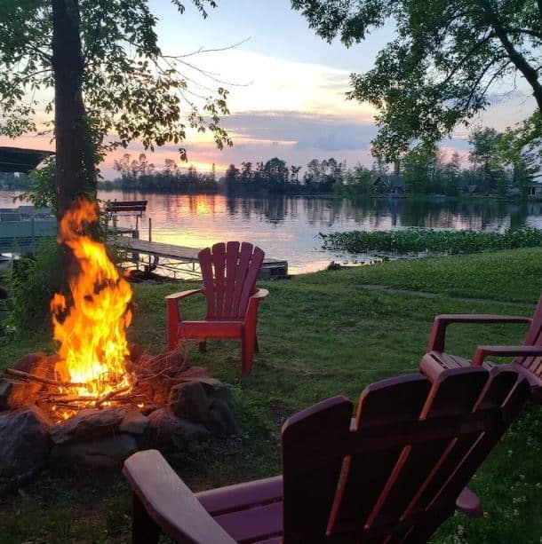 bonfire next to the lake at Cozy Lakefront Cabin Barron County Wisconsin - 15 Best Family Cabins in Wisconsin